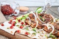 Close up grilled chicken, chicken skewers, pierzola served on pita bread with onion and herbs, spices. eastern shashlik or kebab Royalty Free Stock Photo