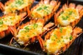 close-up of grilled lobster tails with finely chopped chives Royalty Free Stock Photo