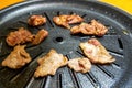 Close-up of grilled pork belly on Korean barbecue grill pan Royalty Free Stock Photo