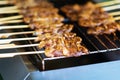 Close up of Grilled pork skewers sweet spicy sauce thai street food market Royalty Free Stock Photo