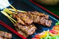 Close up of Grilled pork skewers sweet spicy sauce thai street food market Royalty Free Stock Photo