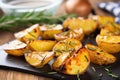 close-up of grilled potatoes scattered with fresh rosemary