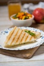 Close up of grilled sandwich in a plate on a platter Royalty Free Stock Photo