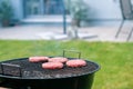 Close up of a grilling beef burger at cozy terrace in summer Royalty Free Stock Photo