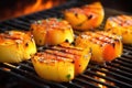 close-up of grilling pineapple skewers on churrasco