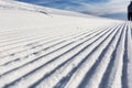 Close-up groomed snow at ski resort, slope banner background texture