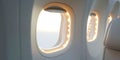 Close-up of a group of airplane windows against a sky of clouds. Airplane cabin. Generative AI Royalty Free Stock Photo