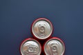 group of aluminium red cans soft drink put on blue texture background Royalty Free Stock Photo