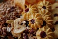 Close-up of a group of assorted cookies, dried fruits and nuts.