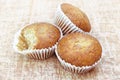 Close up group of banana cup cake bakery, some piece was bited, look delicious on wooden table background