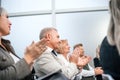 Close up. a group of business people applaud during a business seminar. Royalty Free Stock Photo