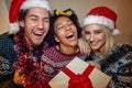 Close-up of a group of cheerful friends having a good time while posing for a photo during a New Year party at home. Christmas, Royalty Free Stock Photo