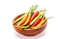 Closeup of group chili pepper on dark wooden cup