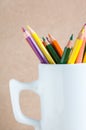 Close-up A group of color pencils in a white cup Royalty Free Stock Photo