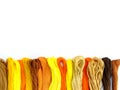 Group of colorful spools of sewing thread top view on white background Royalty Free Stock Photo
