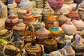 Close Up of Group of Demijohn Wrapped with Colored Cotton