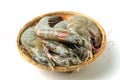 Close up group of fresh raw pacific white shrimp in bamboo bowl on white background Royalty Free Stock Photo