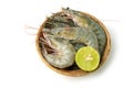 Close up group of fresh raw pacific white shrimp and lemon in bamboo bowl on white background Isolate background Royalty Free Stock Photo