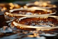 a close up of a group of gold rings sitting on top of water