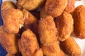 Close-up of a group of golden fried croquettes.