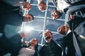 Close up. group of happy young business people standing in a circle. Royalty Free Stock Photo