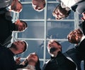 close up. group of happy young business people standing in a circle. Royalty Free Stock Photo