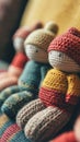 A close up of a group of knitted dolls sitting on top of each other, AI