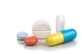 Close-up on group of medicine in capsule, caplet, tablet format on white background