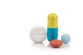 Close-up on group of medicine in capsule, caplet, tablet format on white background