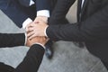 Close up of Group people of businessmen joining putting their hands together with stack of hands showing unity and teamwork. conce Royalty Free Stock Photo