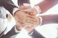 Close up of Group people of businessmen joining putting their hands together with stack of hands showing unity and teamwork. conce Royalty Free Stock Photo