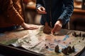 Close-up of a group of people standing near the table with a map, Tourists checking on a map, top section cropped, no visible