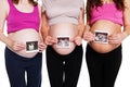 Close up of group pregnant women holding