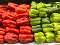 Close up of a group of red and green bell peppers and in a group Royalty Free Stock Photo