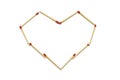 Close up of group of red match stick arrange in heart pattern isolated on a white background