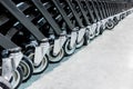 Close-up group of shopping cart wheels. selective focus. Royalty Free Stock Photo