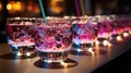 Close-up of group of stylish coloured cocktails with ice and lemon on the bar counter. Generative AI