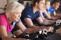 Close Up Of Group Taking Spin Class In Gym Royalty Free Stock Photo