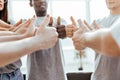 close up. group of young people showing thumbs up. Royalty Free Stock Photo