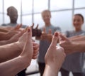 close up. group of young people showing thumbs up. Royalty Free Stock Photo