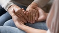 Closeup image adult daughter holding hands of old mother Royalty Free Stock Photo