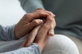 Close up image grown up daughter holding hand of mother Royalty Free Stock Photo