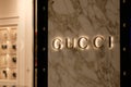 Close up GUCCI logo on granite wall outside store