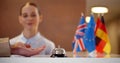 Close up of guest calling bell at hotel reception and taking room key Royalty Free Stock Photo