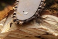 Close-up on the guide and chain of the used chain saw. Royalty Free Stock Photo