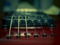 Close up with a guitar bridge and strings Royalty Free Stock Photo