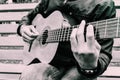 Close-up guitar fingerboard and musician`s fingers on it