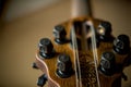 Close-up of a guitar headstock with ornate tuning pegs Royalty Free Stock Photo