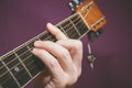 Close up of guitarist hand playing guitar Royalty Free Stock Photo