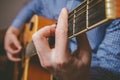 Close up of guitarist hand playing guitar